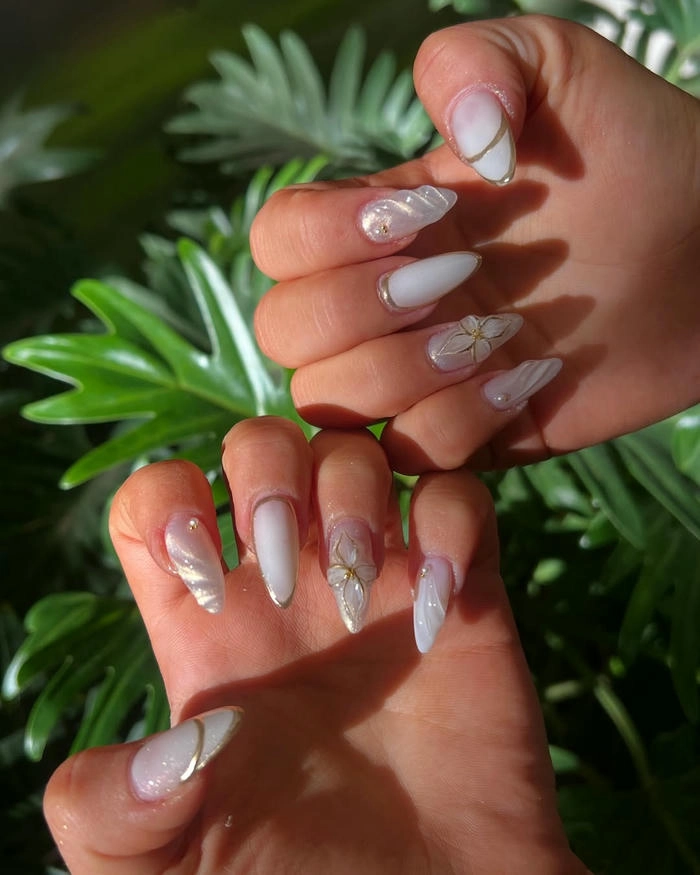 sơn móng tay màu trắng vẽ sáng tạo